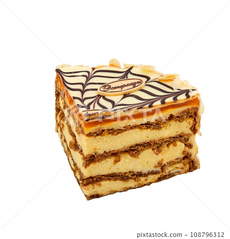 A piece of Esterhazy cake based on protein cakes with walnuts, custard and apricot jam isolated on white 108796312