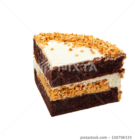 A piece of Cake with chocolate biscuit, cheese cream, salted caramel and peanuts isolated on white 108796335