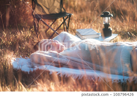 Female solo camp lying down relaxing Female solo camp lying down relaxing 108796426