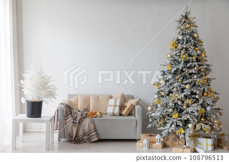 Christmas tree with gifts decorated with toys for new year 108796513