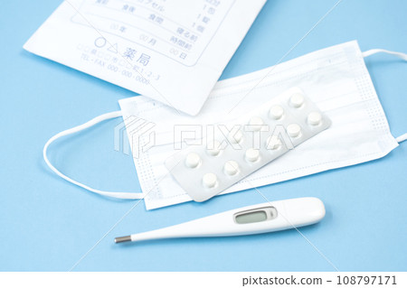Medicine, thermometer, and mask - image of feeling unwell Medicine, thermometer, and mask - image of feeling unwell 108797171
