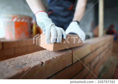 Man laying bricks Man laying bricks 108797392