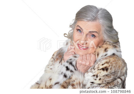 portrait of happy beautiful senior woman in fur coat 108798846