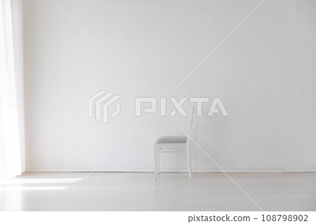 one vintage empty chair in white room interior one vintage empty chair in white room interior 108798902