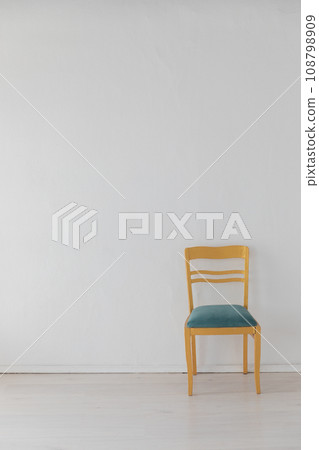 one vintage empty chair in white room interior one vintage empty chair in white room interior 108798909
