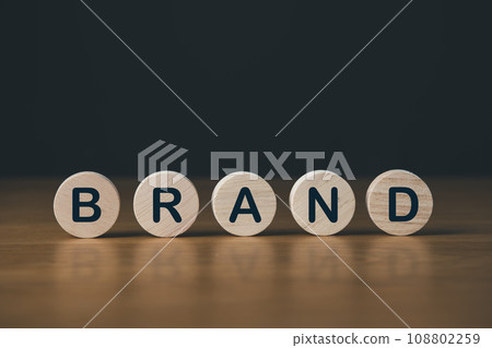 wooden circle with brand text. business brand building and business concept. wooden circle with brand text. business brand building and business concept. 108802259