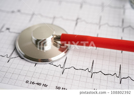 Stethoscope on electrocardiogram ECG, heart wave, heart attack, cardiogram report. 108802392