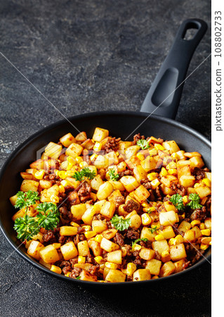Beef Hash with roasted corn, garlic and parsley Beef Hash with roasted corn, garlic and parsley 108802733