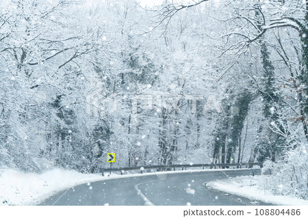 Winter landscape with snow-covered trees and road Winter landscape with snow-covered trees and road 108804486