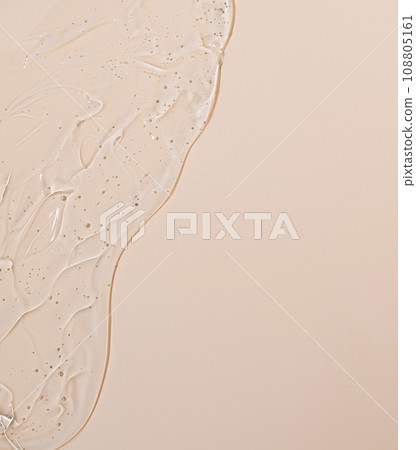 Abstract face serum texture. Skin care liquid gel on beige background. Transparent cosmetic face cream with bubbles for design. Abstract face serum texture. Skin care liquid gel on beige background. Transparent cosmetic face cream with bubbles for design. 108805161