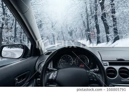 The car moves on a winter road 108805791