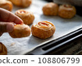 Child's hand taking homemade snack 108806799