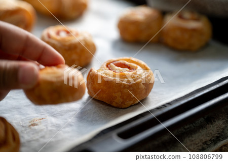 Child's hand taking homemade snack 108806799