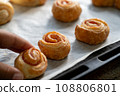 Child's hand taking homemade snack 108806801
