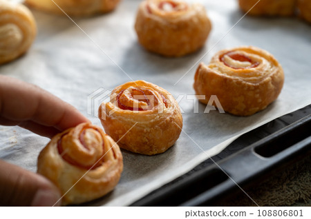 Child's hand taking homemade snack 108806801
