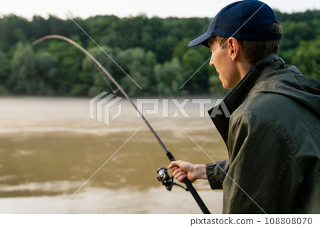 Man fishing on the river 108808070