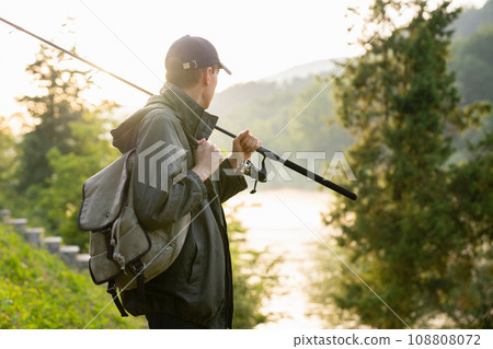 Man fishing on the river 108808072