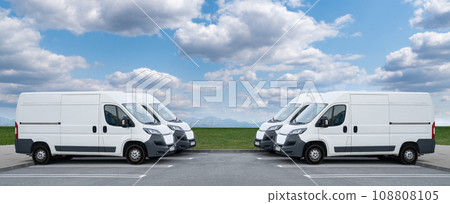 Delivery vans are parked in rows. 108808105