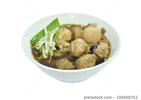boiled braised pork and meatball in black herb soup on bowl boiled braised pork and meatball in black herb soup on bowl 108808352