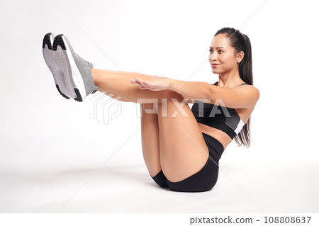 an asian woman is working out wearing the sport exercise suit with white background, an asian woman is working out wearing the sport exercise suit with white background, 108808637