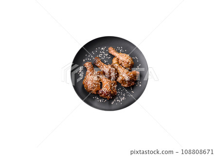 Delicious grilled chicken wings with salt, spices and teriyaki sauce 108808671
