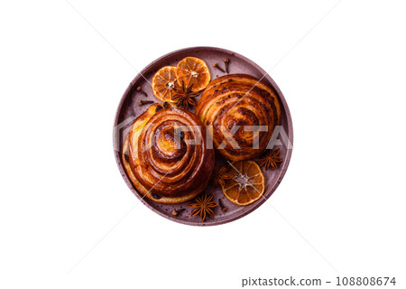 Delicious baked cinnamon raisin rolls in the form of rolls Delicious baked cinnamon raisin rolls in the form of rolls 108808674