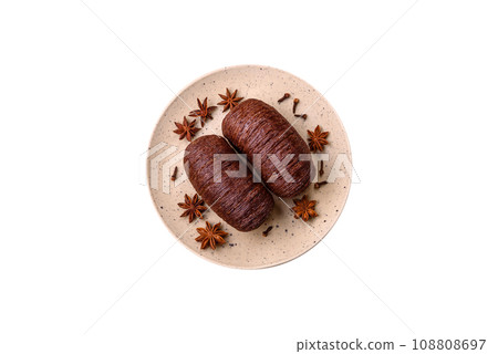 Delicious sweet crispy puff pastry with chocolate filling Delicious sweet crispy puff pastry with chocolate filling 108808697