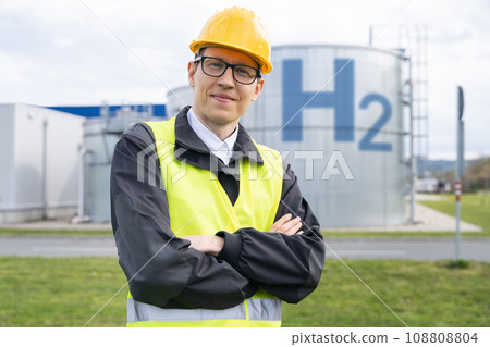 Engineer in helmet on a background of Hydrogen factory Engineer in helmet on a background of Hydrogen factory 108808804