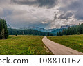 The road along the alpine meadows. High mountains. 108810167