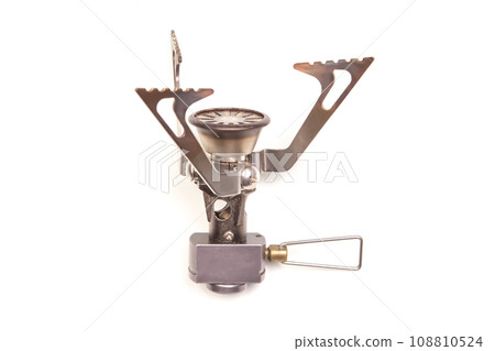 compact gas burner and lighter on a white background. tool for tourism and camping. 108810524