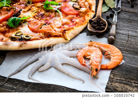Tasty seafood pizza Tasty seafood pizza 108810742