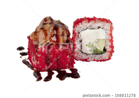 Sushi rolls boned in red artificial caviar and poured with soy sauce on a white background close-up. 108811278