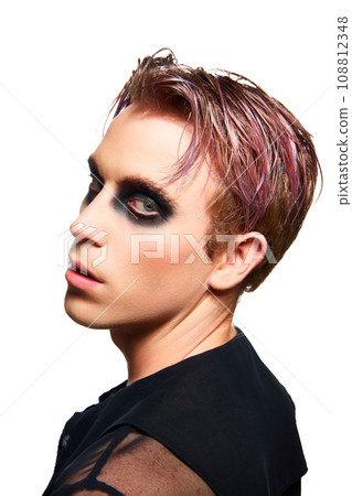 Portrait of young man with pink dyed hair, smoky eyes makeup posing isolated on white studio background 108812348