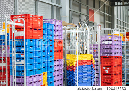 Plastic Crates Stacked behind food grocery retail store for supply chain products shipping distribution and business market consumption concept. 108812580