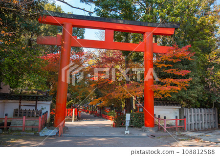Torii red wooden gate Japan traditional in Shinto shrines temple entrance symbol of transition from the mundane to the sacred 108812588