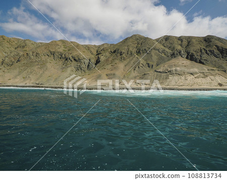 California Sea lion colony relaxing on the rocks in front of Pacific Ocean of Santa Margherita island in Baja California Sur, Mexico 108813734