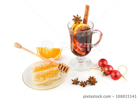 Mulled wine, spices and Christmas decor isolated on white . 108815141
