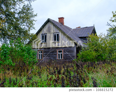 Abandoned old wooden country house in the countryside of Latvia Abandoned old wooden country house in the countryside of Latvia 108815272