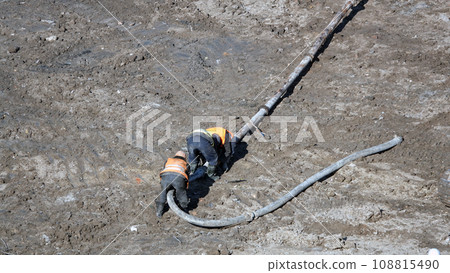 Kiev, Ukraine March 13, 2019:  Workers - zero-cycle construction of the foundation of an entertainment center Kiev, Ukraine March 13, 2019:  Workers - zero-cycle construction of the foundation of an entertainment center 108815490