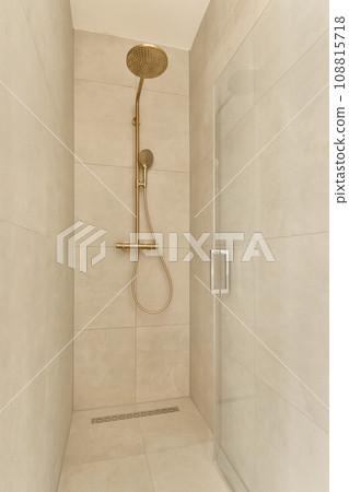 a walk in shower that is very clean and ready to be used for the next day's washroom 108815718