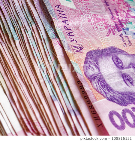 A bunch of Ukrainian Hryvnia banknotes, including the two hundred hryvnias denomination, is presented in this close-up, providing a detailed look at the diversity of Ukrainian currency. A bunch of Ukrainian Hryvnia banknotes, including the two hundred hryvnias denomination, is presented in this close-up, providing a detailed look at the diversity of Ukrainian currency. 108816131