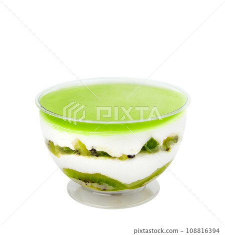 Dessert based on delicate vanilla cream souffle with pieces of natural kiwi isolated on white Dessert based on delicate vanilla cream souffle with pieces of natural kiwi isolated on white 108816394