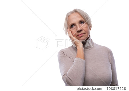 Mature woman with gray hair is worried and sad Mature woman with gray hair is worried and sad 108817228