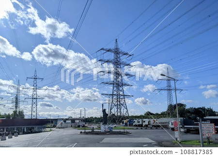 High voltage electrical towers in cloudy sky 108817385