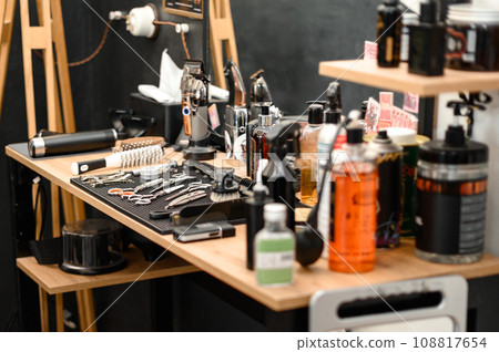 Barbers tools for mens haircuts laid out on a table Barbers tools for mens haircuts laid out on a table 108817654
