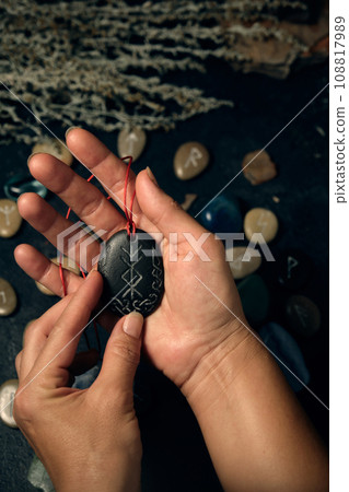 stone runic talisman for good luck in your hand stone runic talisman for good luck in your hand 108817989