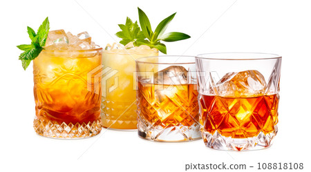 Set of Mai Tai cocktails in a classic tiki glass with crushed ice and a fresh mint Set of Mai Tai cocktails in a classic tiki glass with crushed ice and a fresh mint 108818108