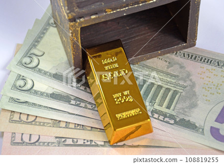 open chest, gold bar and dollars on a white background open chest, gold bar and dollars on a white background 108819255