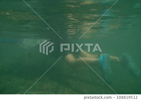 outing to the riverside, playing in a river, younger 108819512
