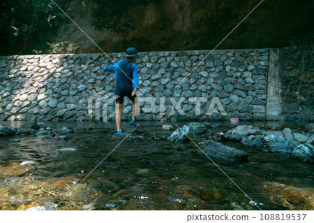 outing to the riverside, playing in a river, younger 108819537